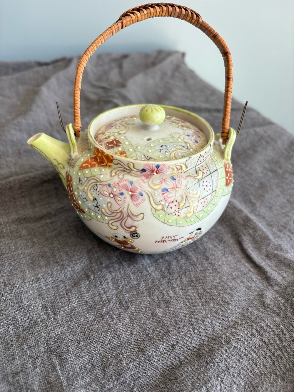 Hand-Painted Ceramic Teapot in Pale Green with Wicker Handle